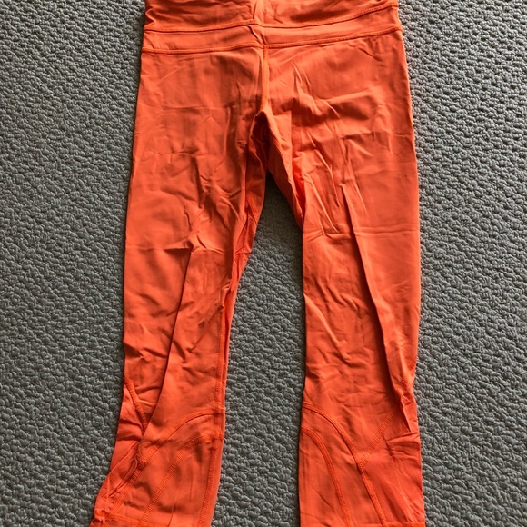 Lululemon neon orange 7/8 leggings. - Picture 1 of 3